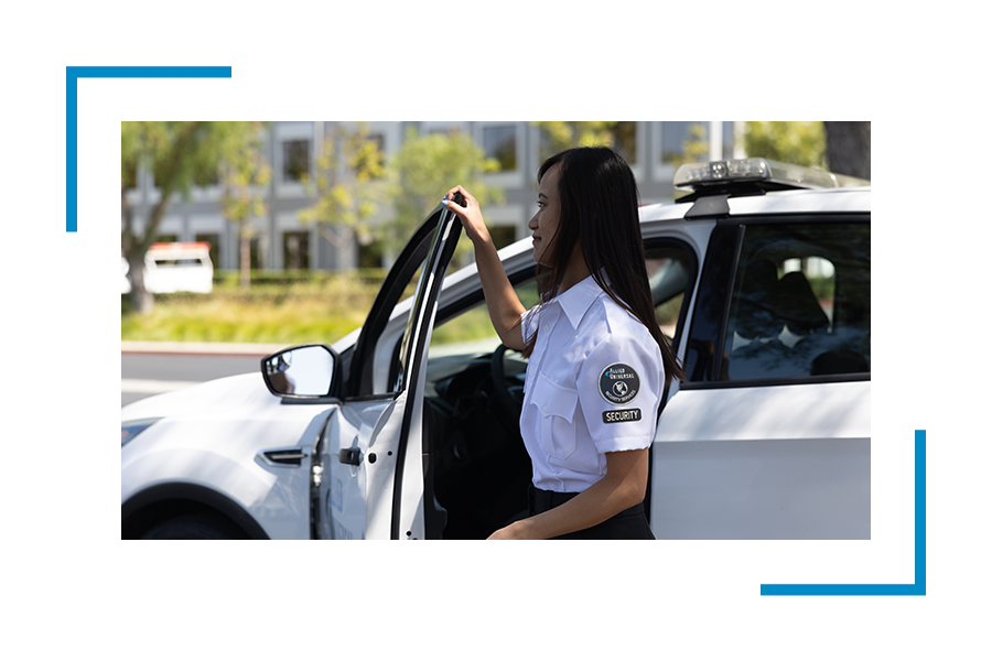 Allied Universal security specialist monitoring a controlled site entrance during a labour dispute.