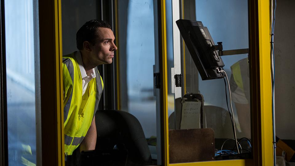 a security professional monitoring a security camera