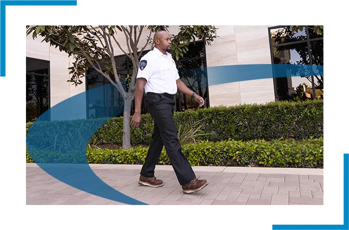 Security guard in white uniform is walking